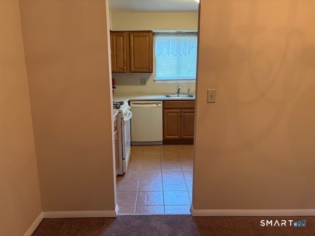31 Sutton Place, Unit 31 Bloomfield, CT 06002 - Photo 8 of 28 a view of a kitchen with a sink and a refrigerator