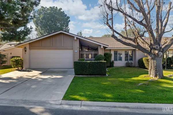 a view of a yard in front view of a house