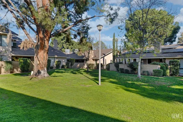 a view of a porch with a table and chairs