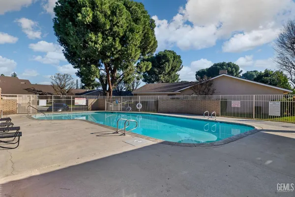 a house with trees in the background