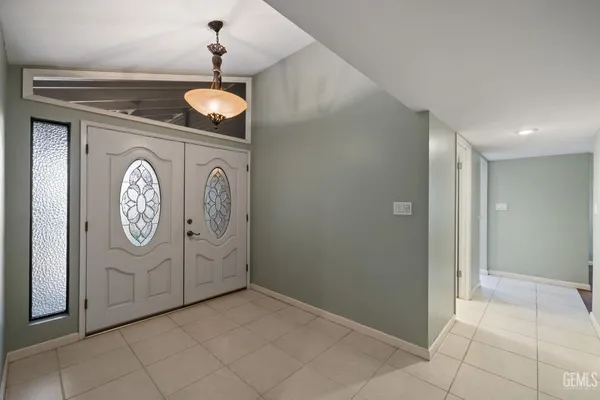 a view of a storage and utility room with washer and dryer