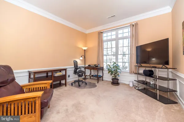 a kitchen with stainless steel appliances granite countertop wooden cabinets a sink and a stove