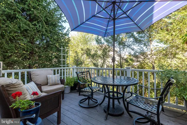 a view of a table and chairs under an umbrella