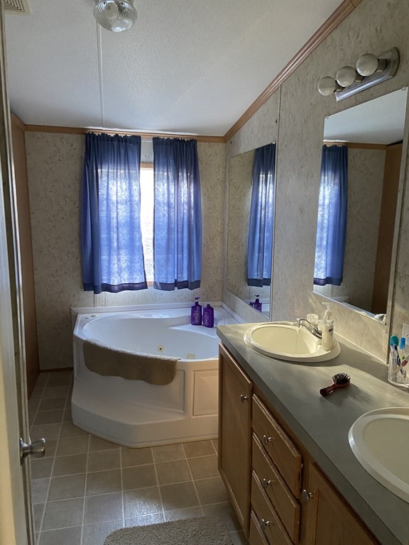 65 Gauthier Road Barre, MA 01005 - Photo 12 of 17 a bathroom with a sink and a mirror