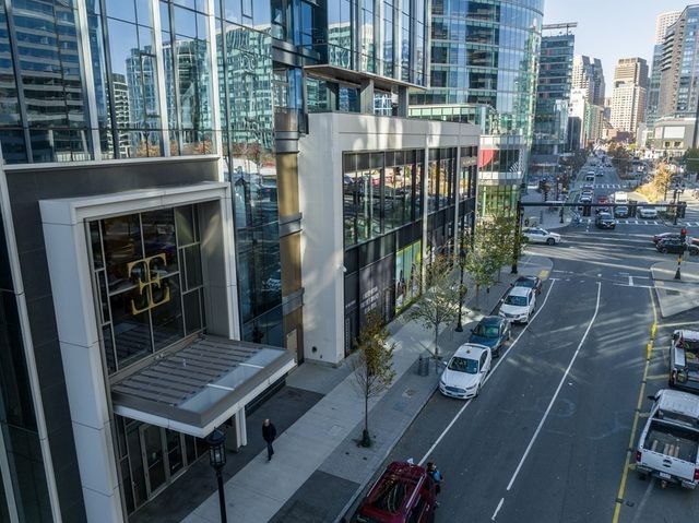 a view of a balcony with wooden floor