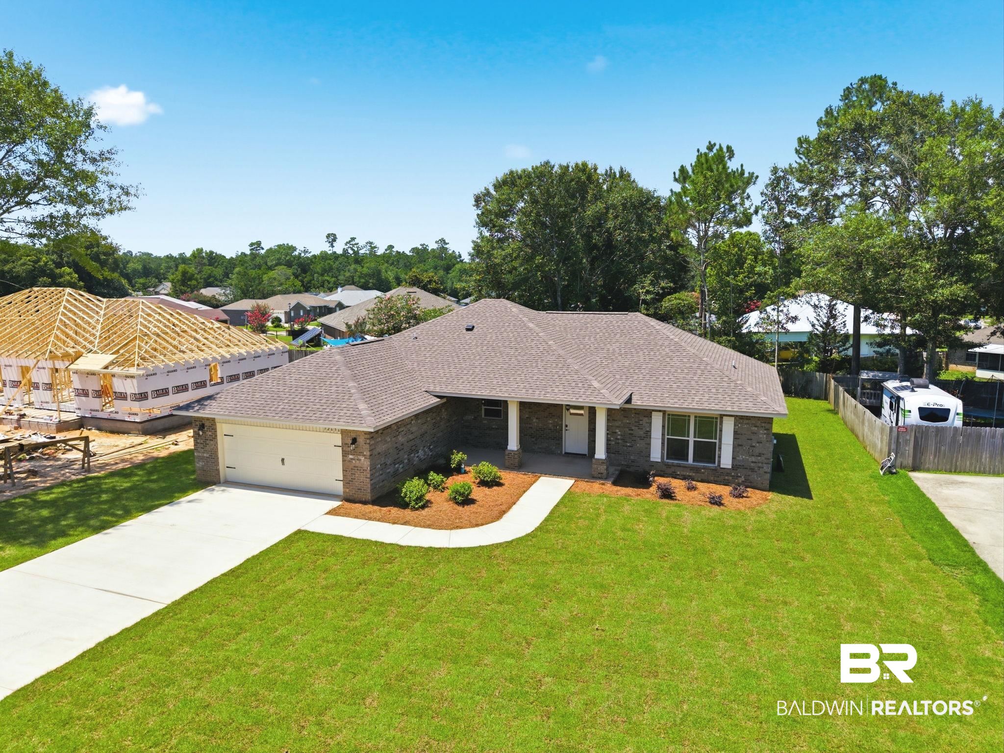 32656 Arbor Ridge Circle Lillian, AL 36549 - Photo 40 of 56 Brick exterior with white trim and a brown shingle roof