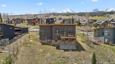 a aerial view of a house with a yard