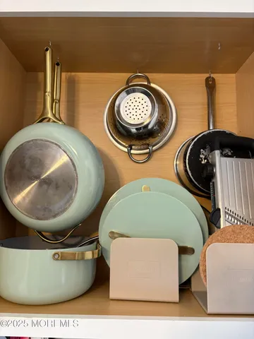 a kitchen with stainless steel appliances a stove a microwave and a refrigerator