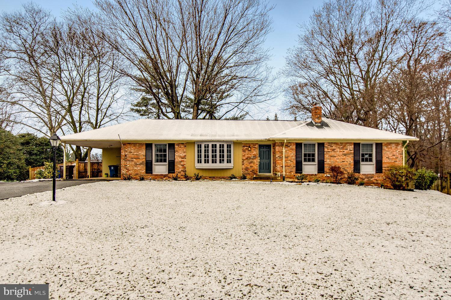 18908 Bloomfield Road Olney, MD 20832 - Photo 1 of 30 a front view of a house with a yard covered with trees