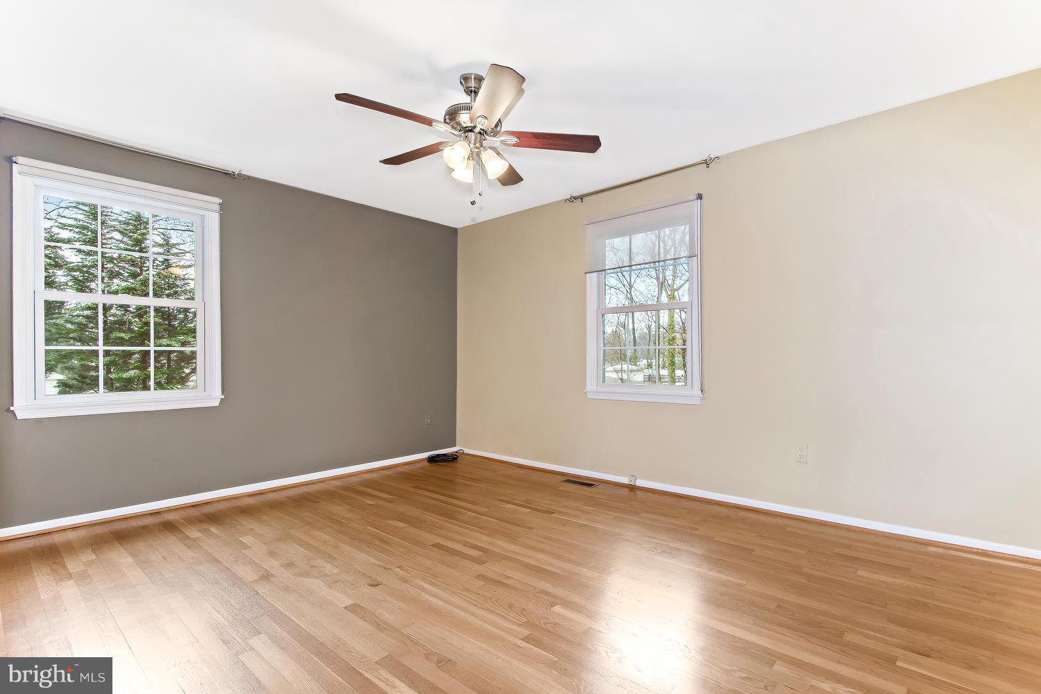 18908 Bloomfield Road Olney, MD 20832 - Photo 11 of 30 a view of an empty room with wooden floor and a window