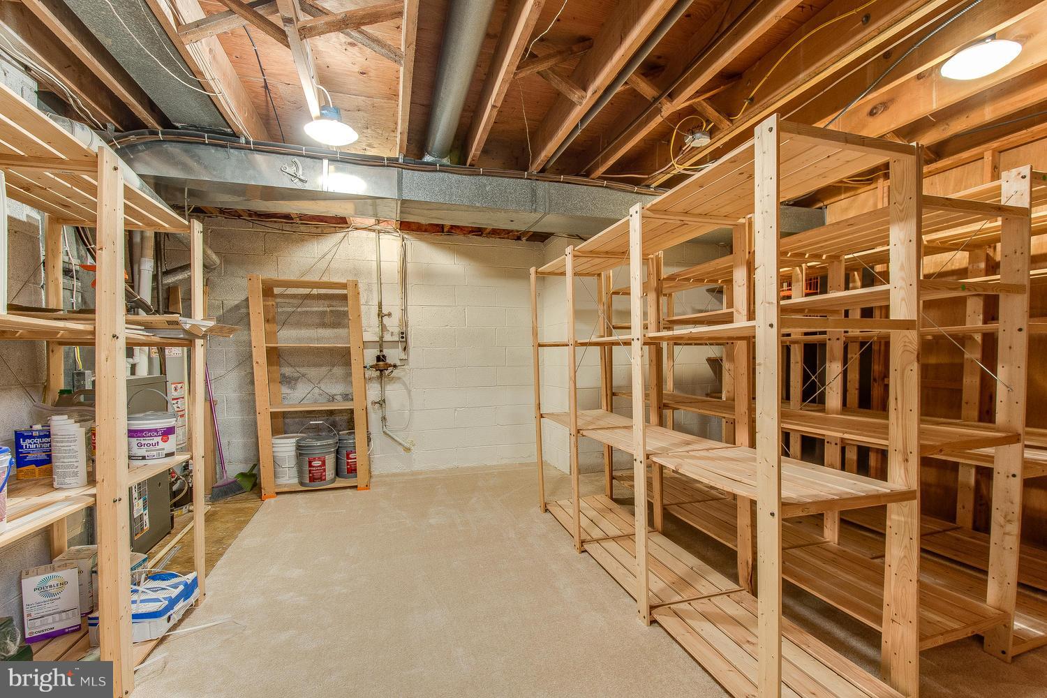 18908 Bloomfield Road Olney, MD 20832 - Photo 25 of 30 a view of walk in closet with clothes and shoes