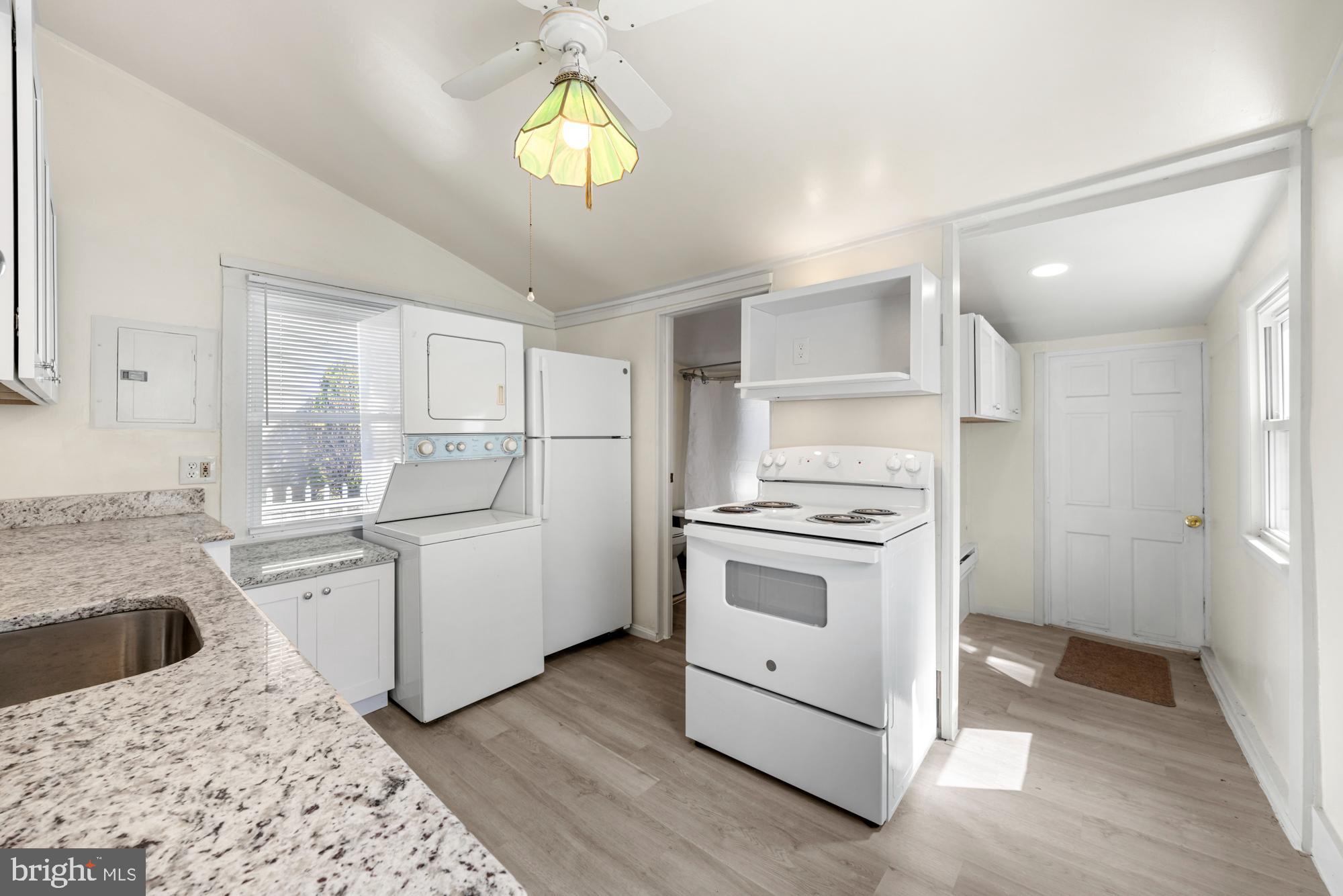 131 North Avenue Pitman, NJ 08071 - Photo 11 of 17 a kitchen with a stove a sink and a refrigerator