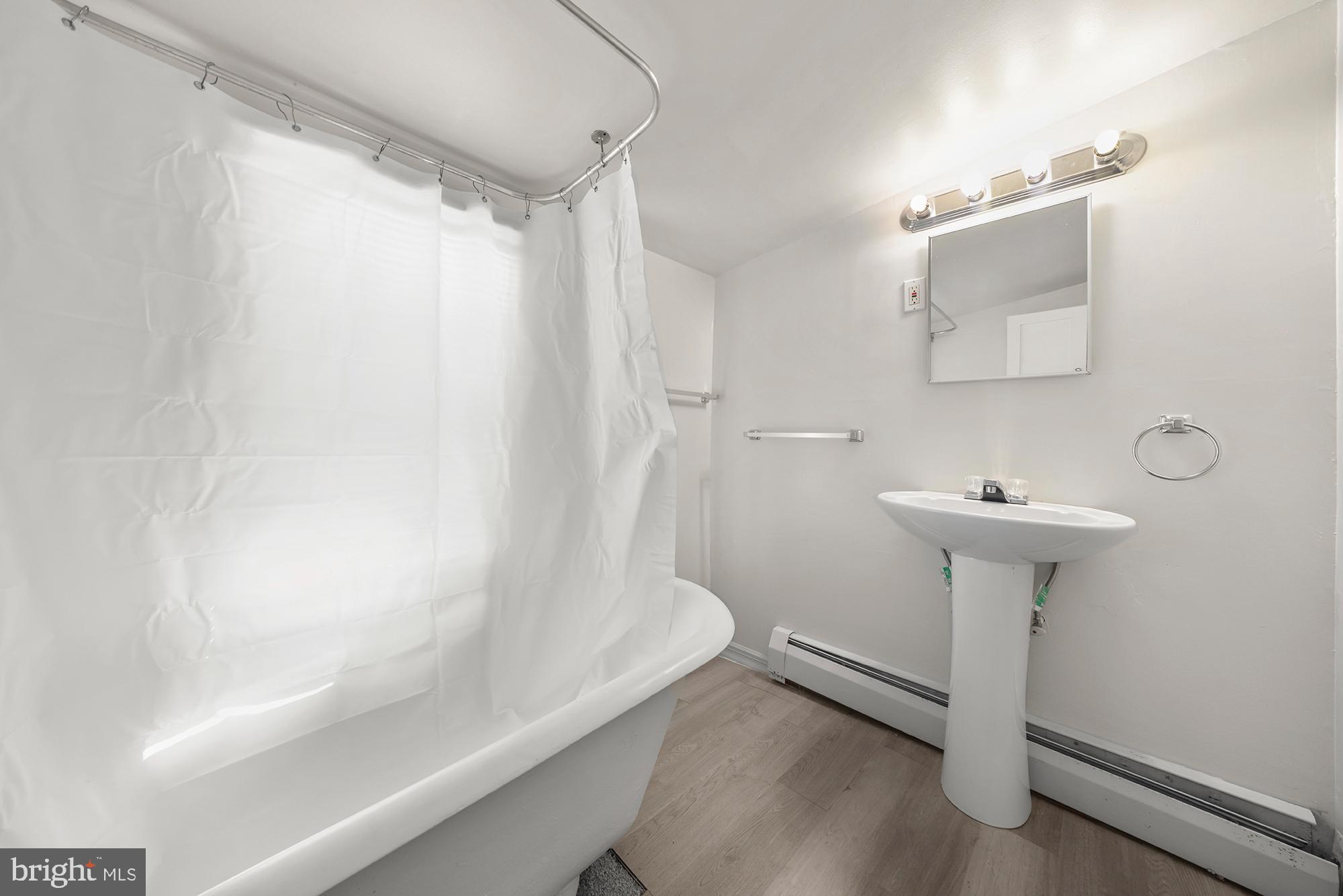 131 North Avenue Pitman, NJ 08071 - Photo 13 of 17 a bathroom with a sink a toilet and shower