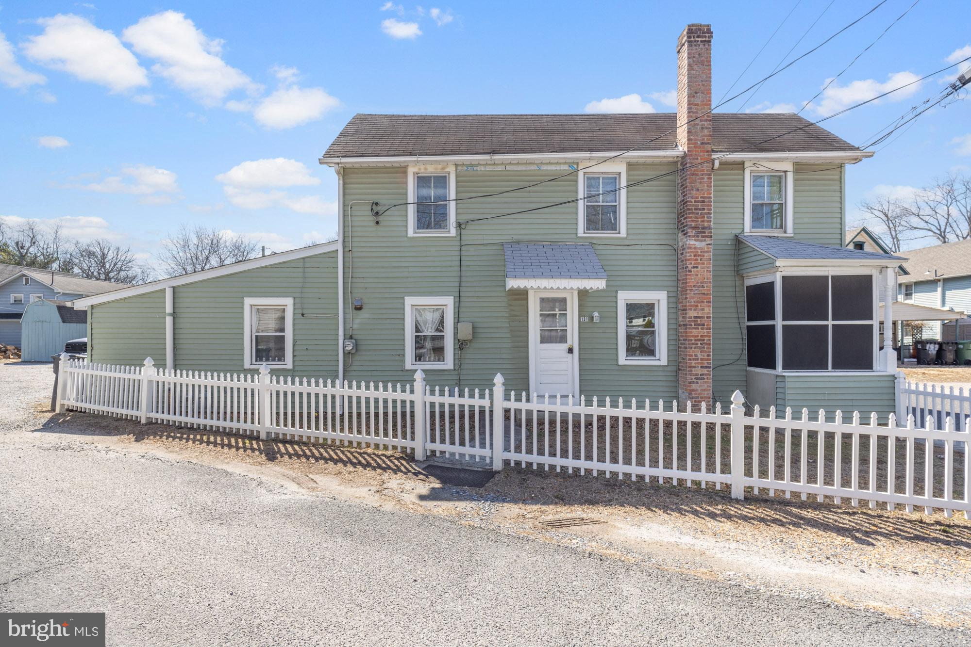 131 North Avenue Pitman, NJ 08071 - Photo 2 of 17 a front view of a house with a fence