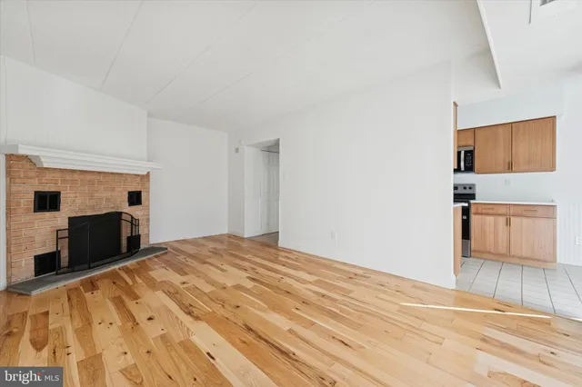 a view of a livingroom with an empty space and window