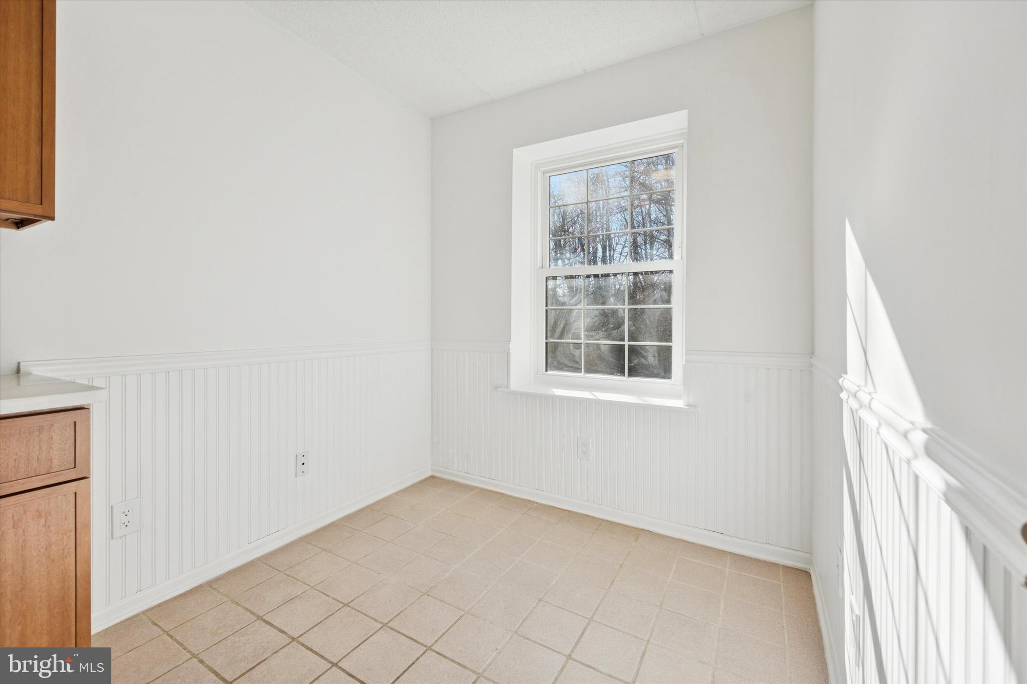 612 Washington Place, Unit 12 Chesterbrook, PA 19087 - Photo 7 of 15 a view of a livingroom with an empty space and window