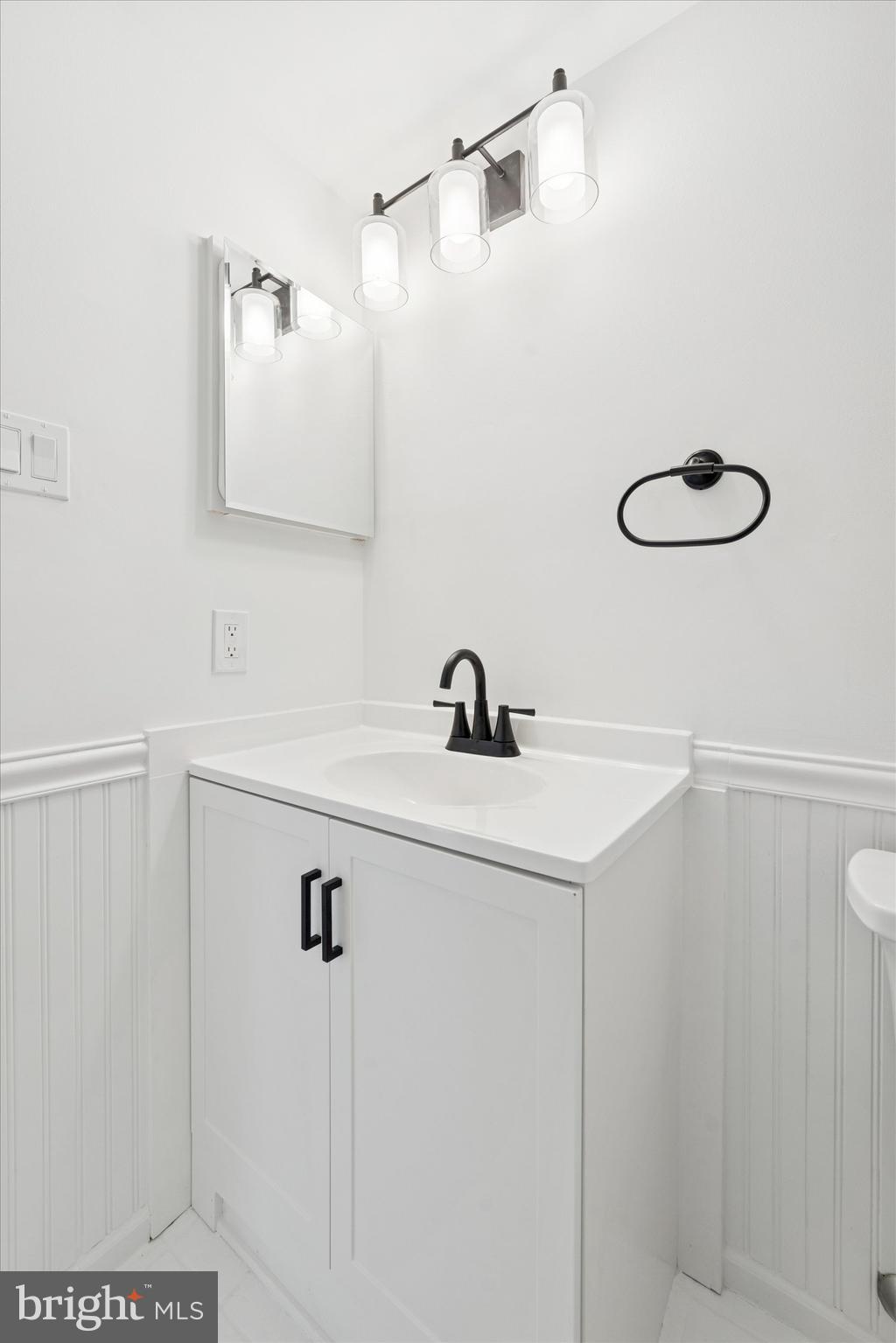 612 Washington Place, Unit 12 Chesterbrook, PA 19087 - Photo 9 of 15 a bathroom with a sink and a mirror
