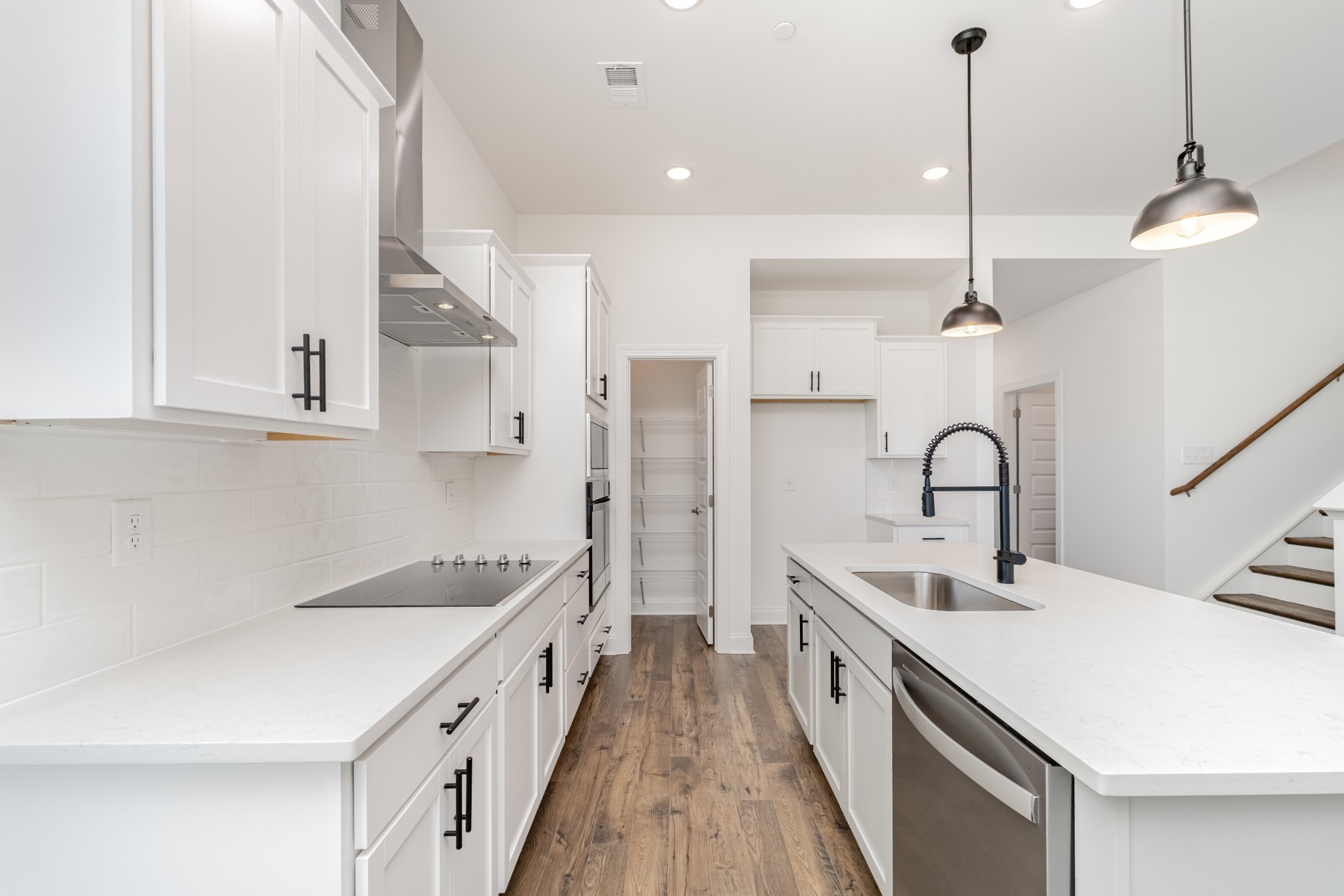 6425 Waymeet Dr Spring Hill Spring Hill, TN 37174 - Photo 11 of 40 a kitchen with white cabinets appliances and a counter space