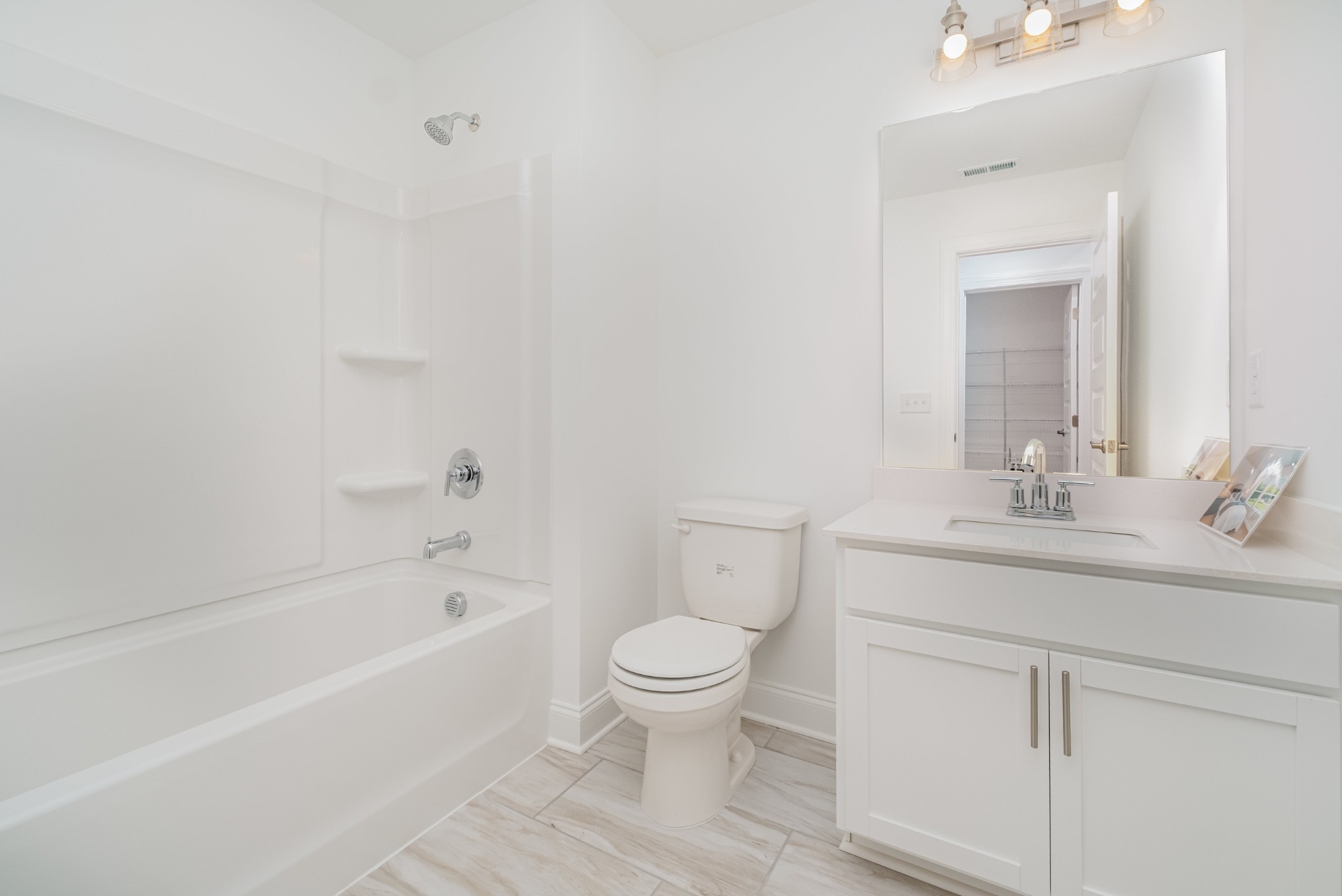 6425 Waymeet Dr Spring Hill Spring Hill, TN 37174 - Photo 22 of 40 a bathroom with a sink a toilet and a bathtub