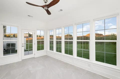 a view of an empty room with a large window