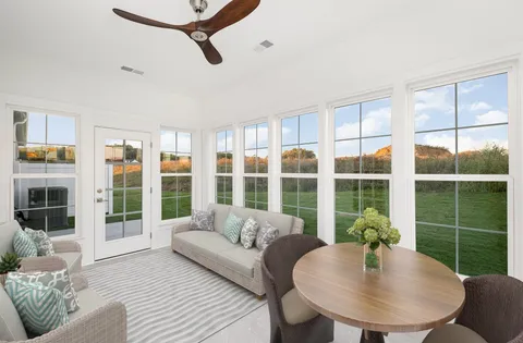 a living room with furniture and a window