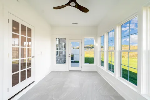 a view of an empty room with a balcony