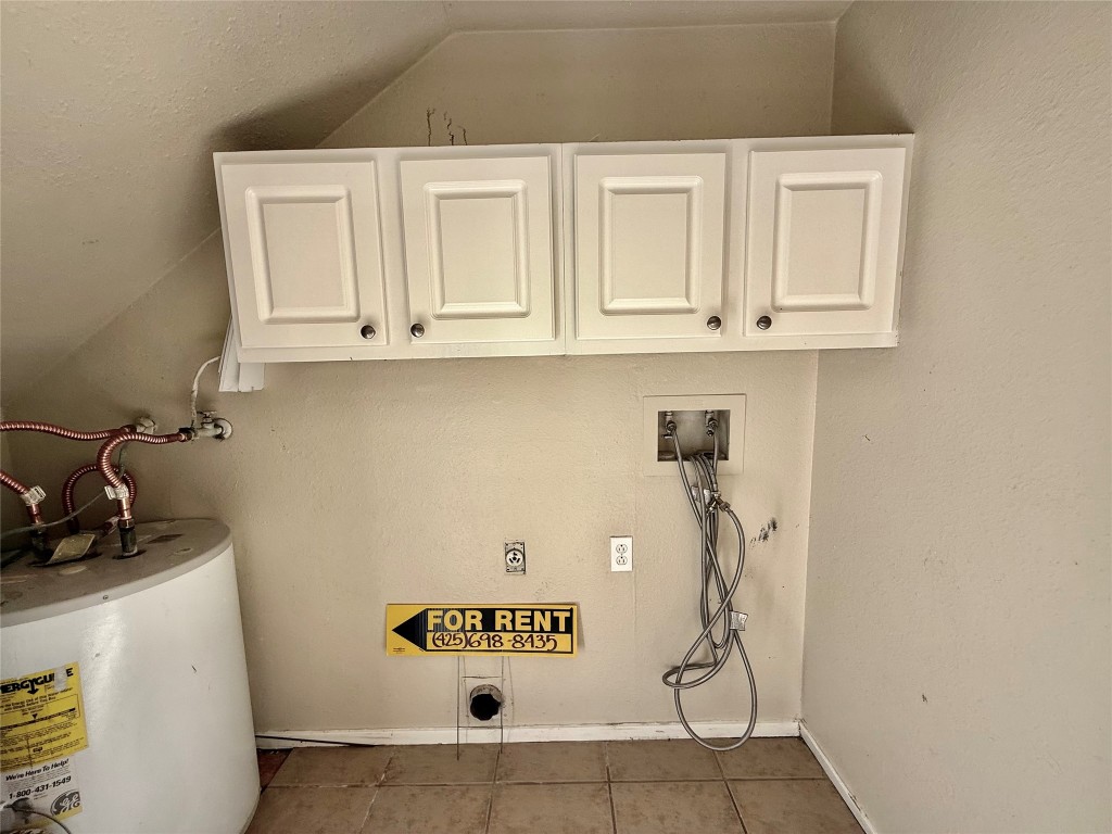 2018 West Rundberg Lane, Unit 6A Austin, TX 78758 - Photo 16 of 16 a bathroom with a sink and cabinets