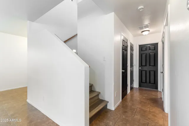 a view of a workspace with furniture and wooden floor