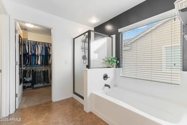 a bathroom with a shower and a bathtub