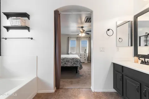 a bedroom with a bed and a dresser