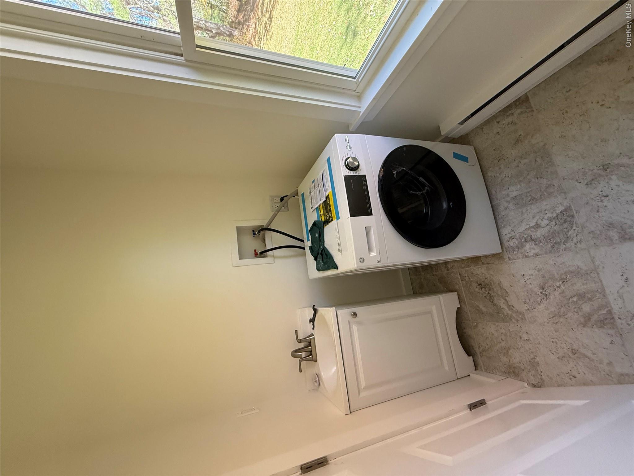 553 Cold Spring Road Monticello, NY 12701 - Photo 12 of 15 a utility room with dryer and washer