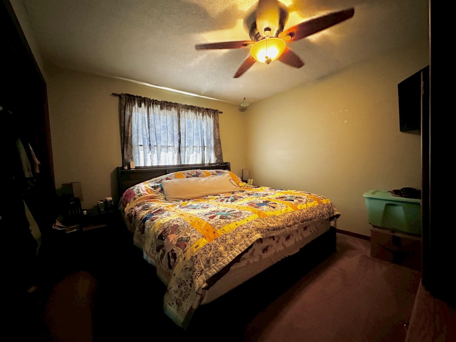 919 3rd Avenue Fulton, IL 61252 - Photo 1 of 24 a bed sitting in a bedroom next to a window