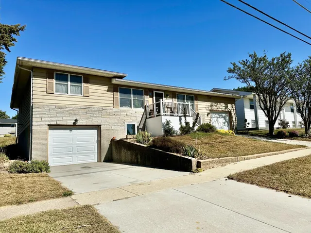 a front view of building with yard