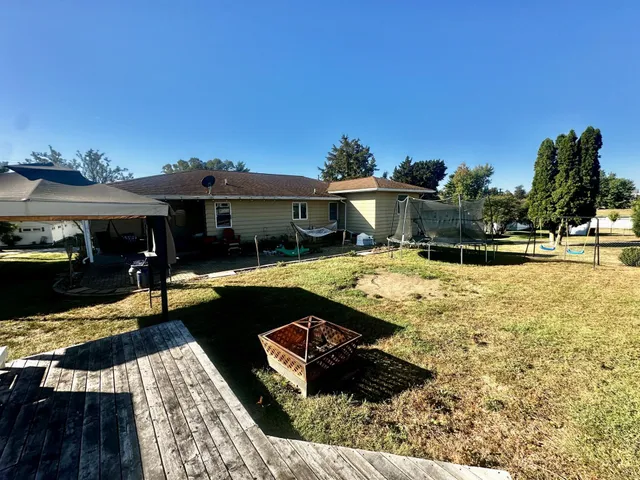 a swimming pool view with a outdoor seating