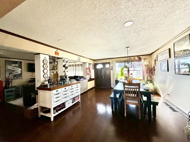 a bedroom with furniture and wooden floor