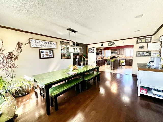 a room with lots of furniture and wooden floor
