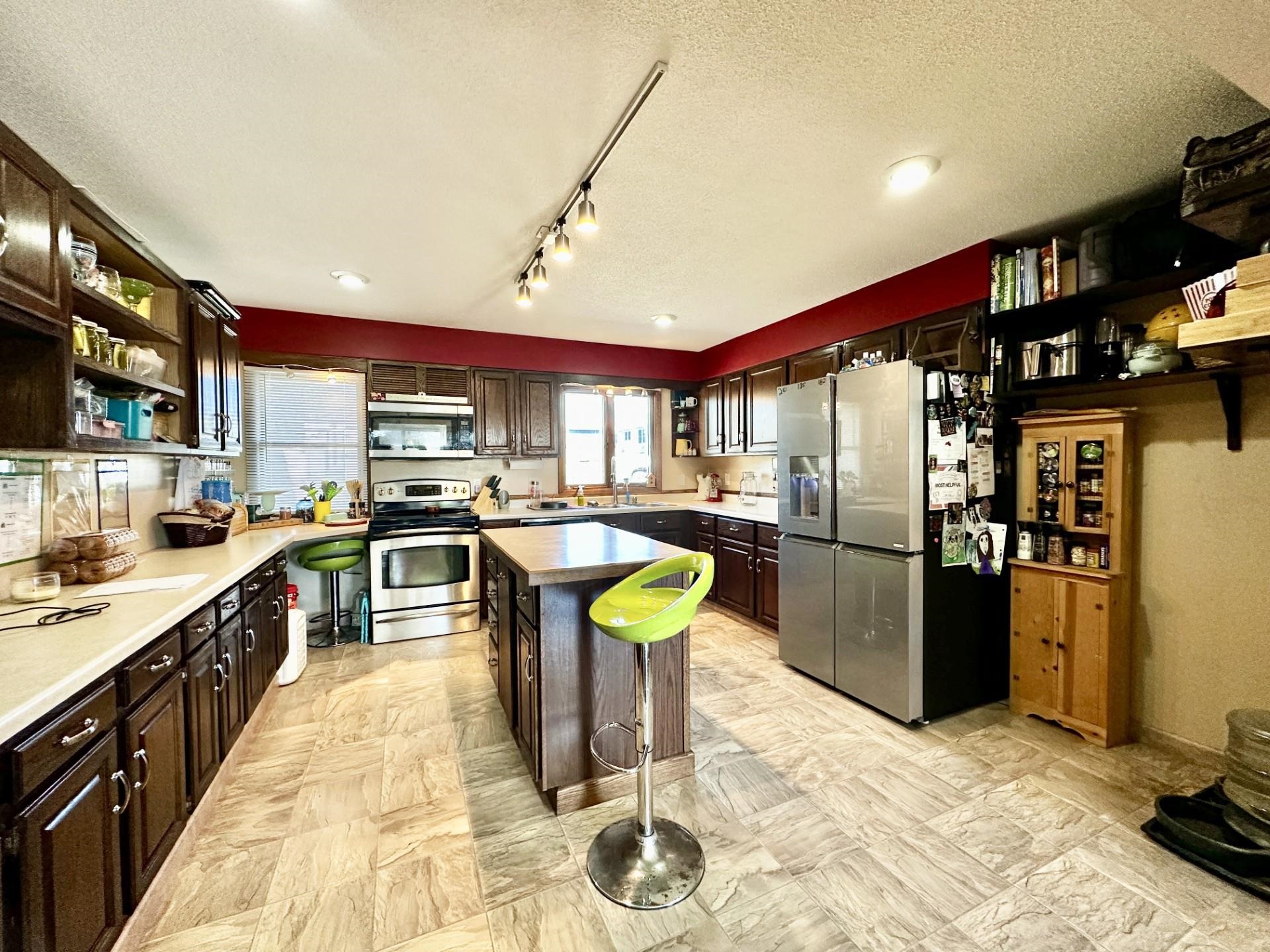 919 3rd Avenue Fulton, IL 61252 - Photo 5 of 24 a kitchen with stainless steel appliances granite countertop a refrigerator a stove and a sink