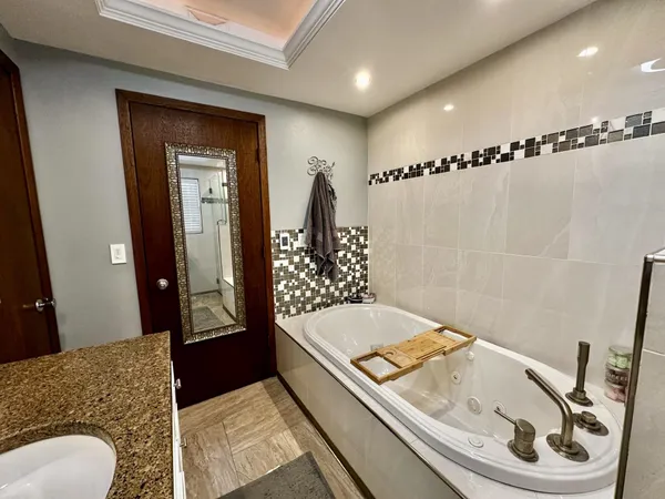 a view of an entryway with wooden floor