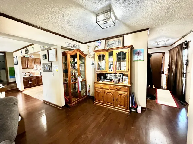 a view of an entryway with wooden floor