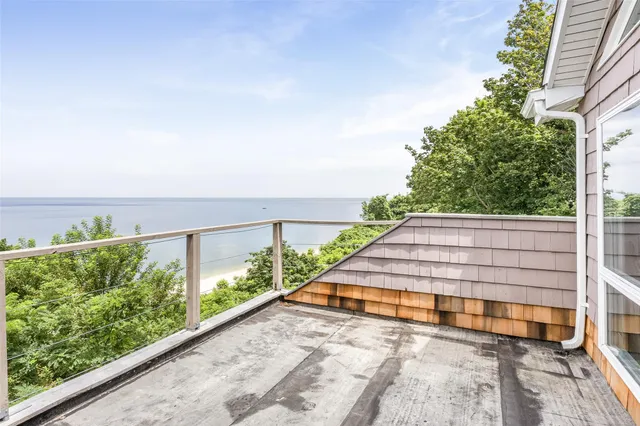 a view of a balcony with ocean view
