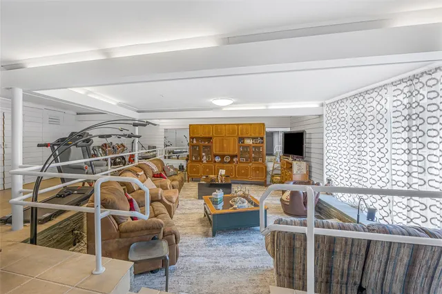 a view of a livingroom with furniture and white walls