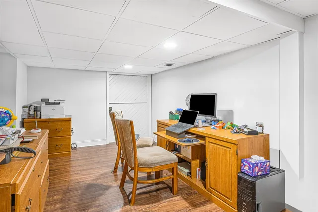 a room with furniture a flat screen tv and a table