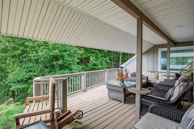 a view of a patio with wooden floor