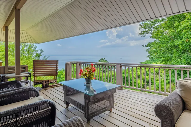 a view of a chairs and table in the patio