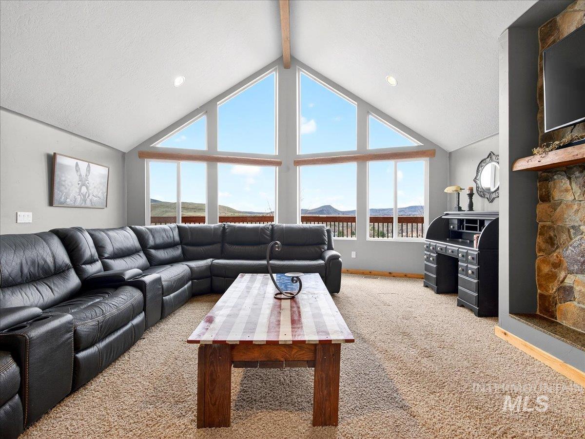 11714 Chukar Ridge Lane Horseshoe Bend, ID 83629 - Photo 11 of 50 Living area featuring light colored carpet, a textured ceiling, and recessed lighting