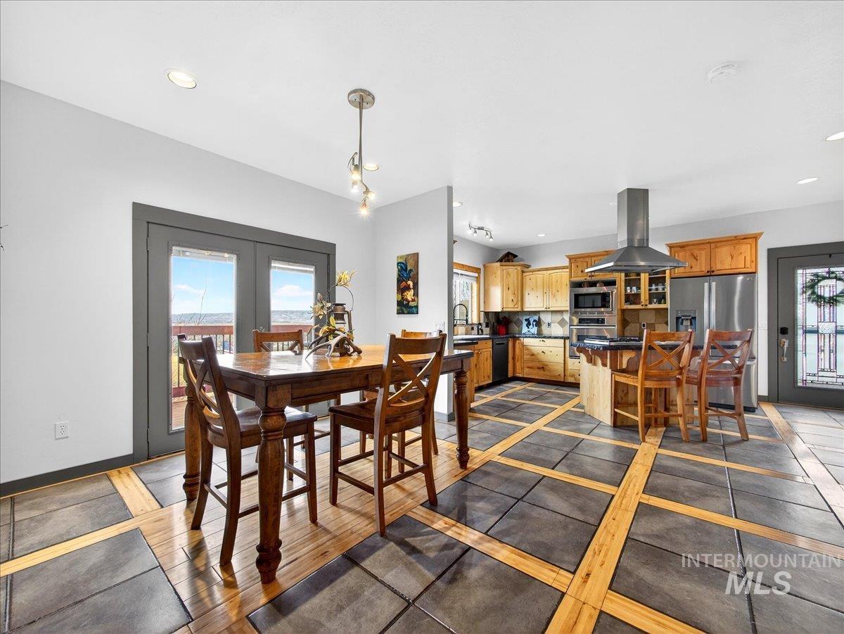 11714 Chukar Ridge Lane Horseshoe Bend, ID 83629 - Photo 17 of 50 Dining space with inlaid floor details, recessed lighting, and french doors