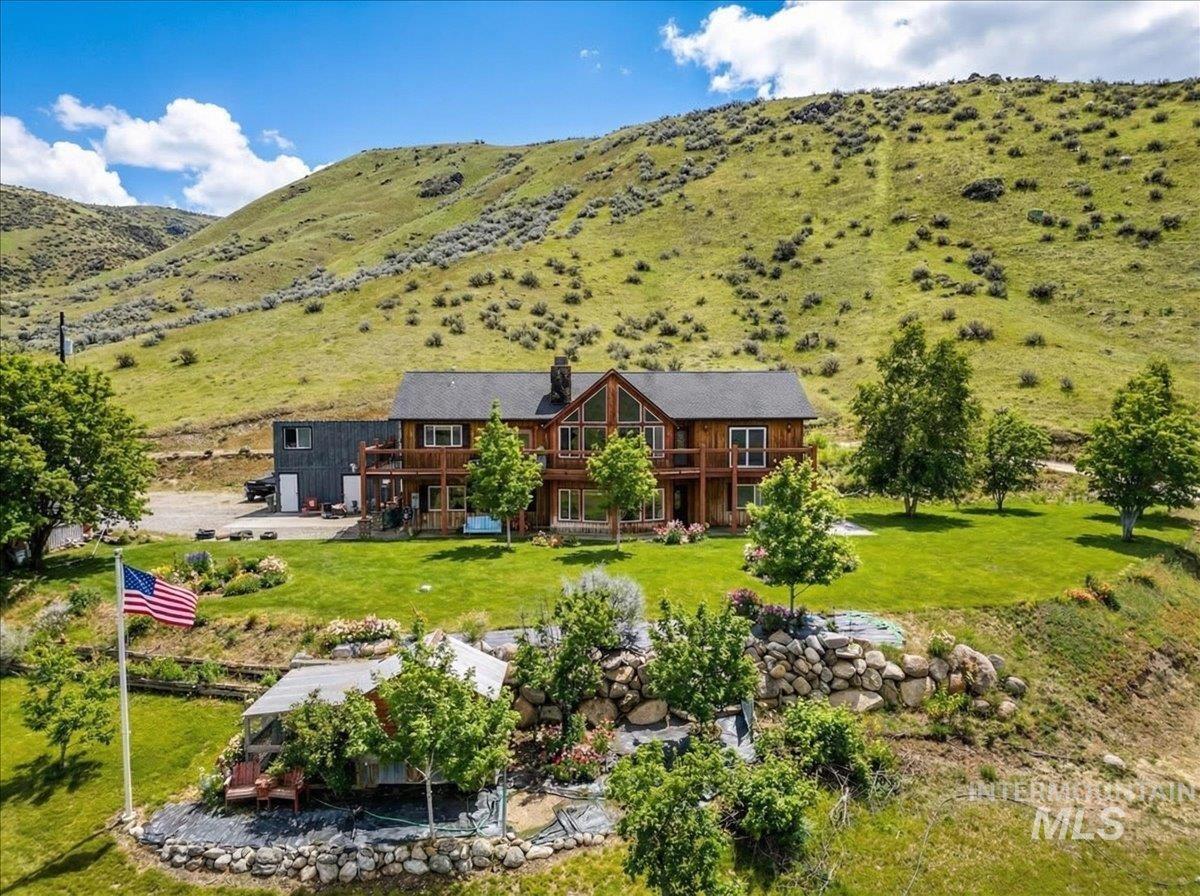 11714 Chukar Ridge Lane Horseshoe Bend, ID 83629 - Photo 3 of 50 Aerial view of property and surrounding area with a mountain backdrop