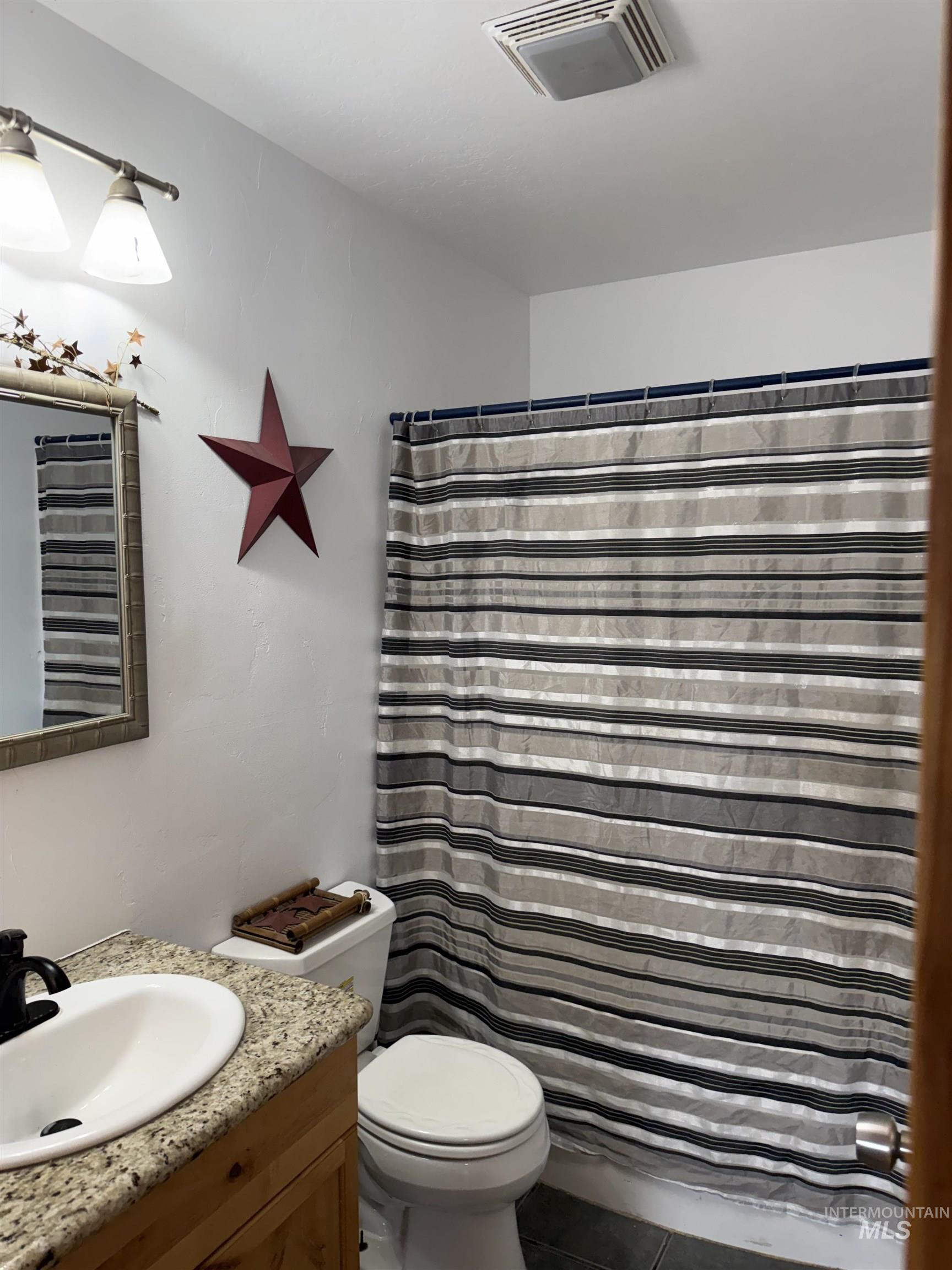 11714 Chukar Ridge Lane Horseshoe Bend, ID 83629 - Photo 36 of 50 Full bathroom with vanity and a shower with curtain