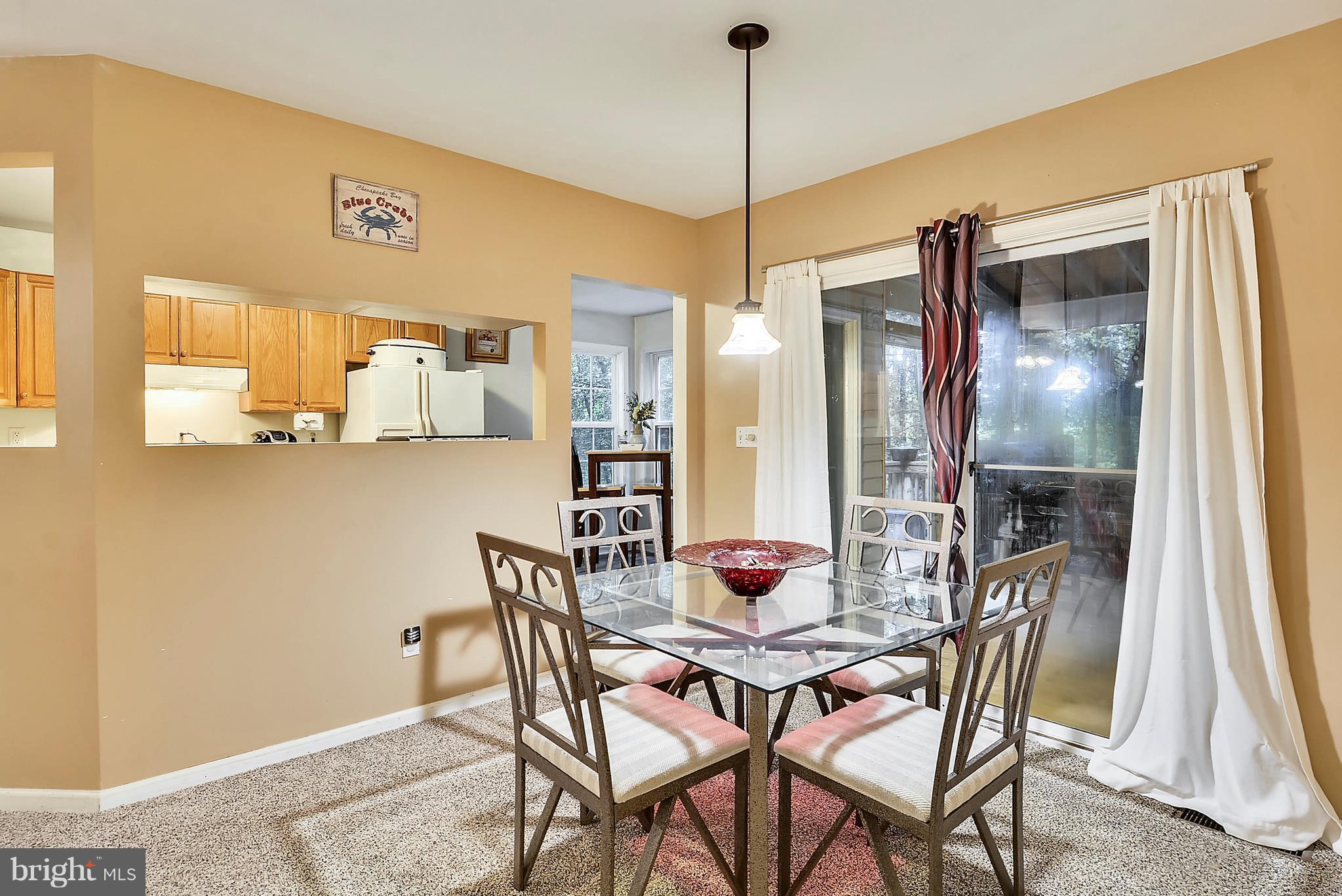 24882 Riverview Way Ridgely, MD 21660 - Photo 9 of 30 Dining Room with sliders to screened back porch