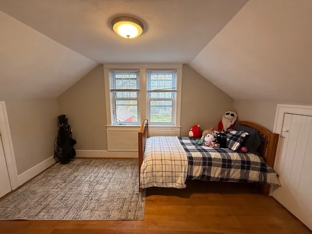a bedroom with two beds and a window